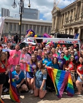 Employees at a PRIDE event